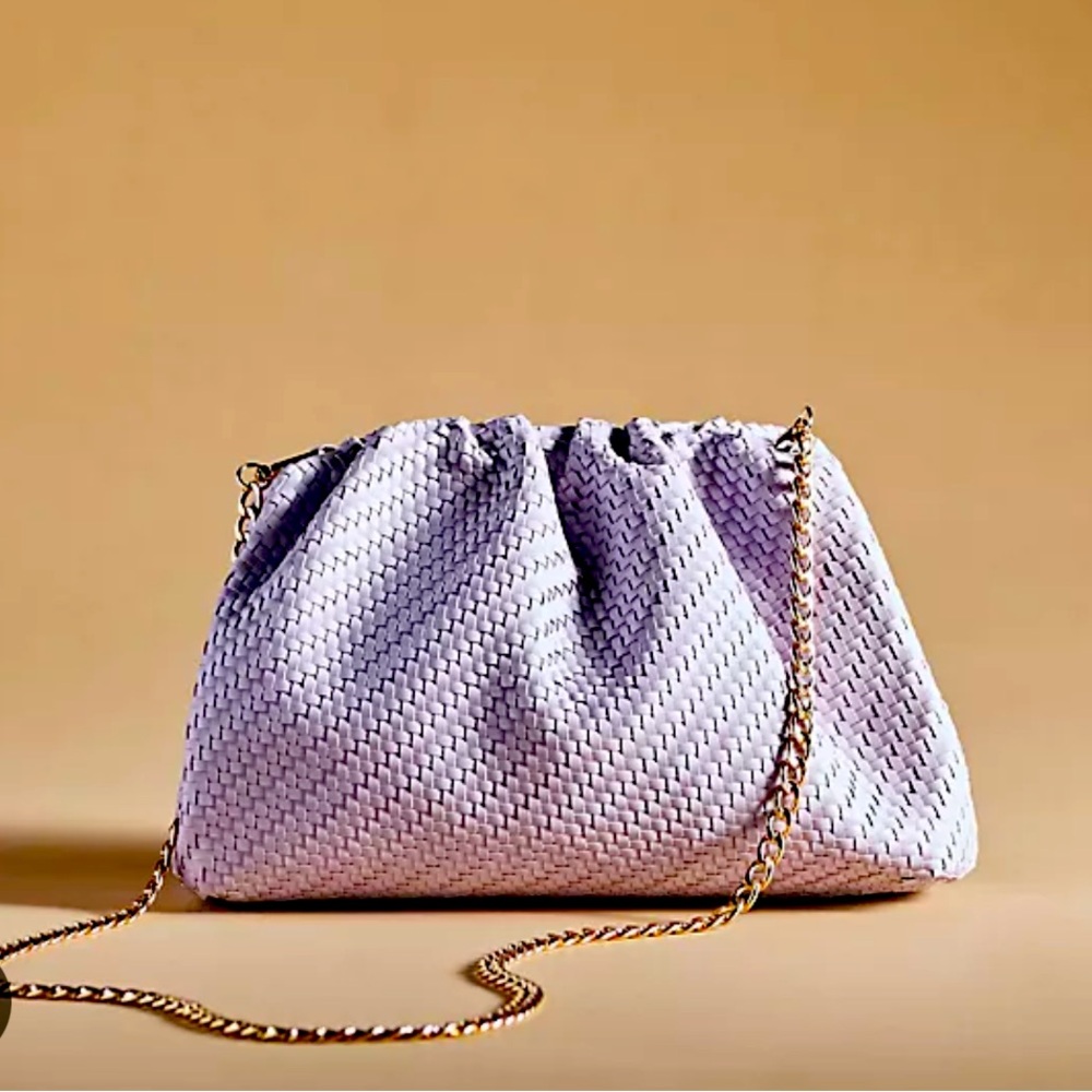 Lavender Frankie clutch by Anthropologie